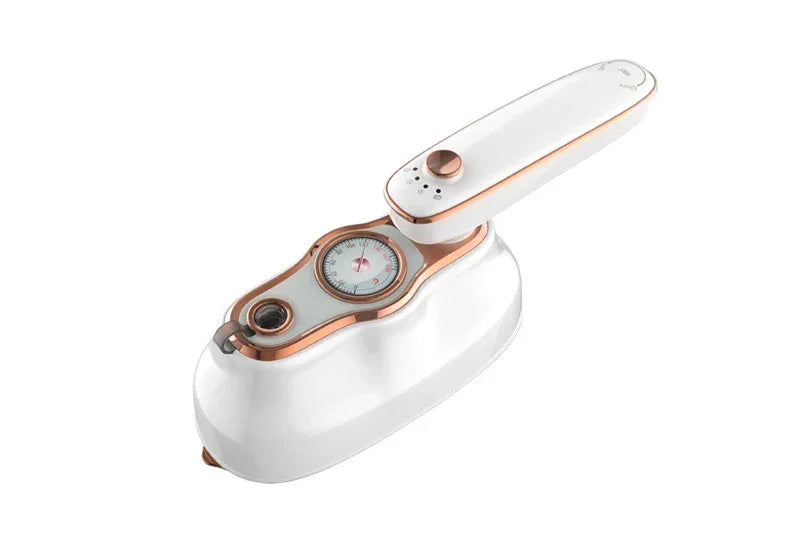 White handheld steam iron with rose gold accents and built-in temperature gauge