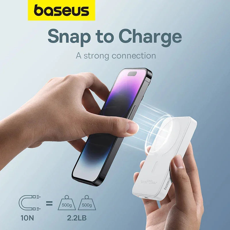 Hands holding a smartphone and a magnetic wireless charger for fast charging